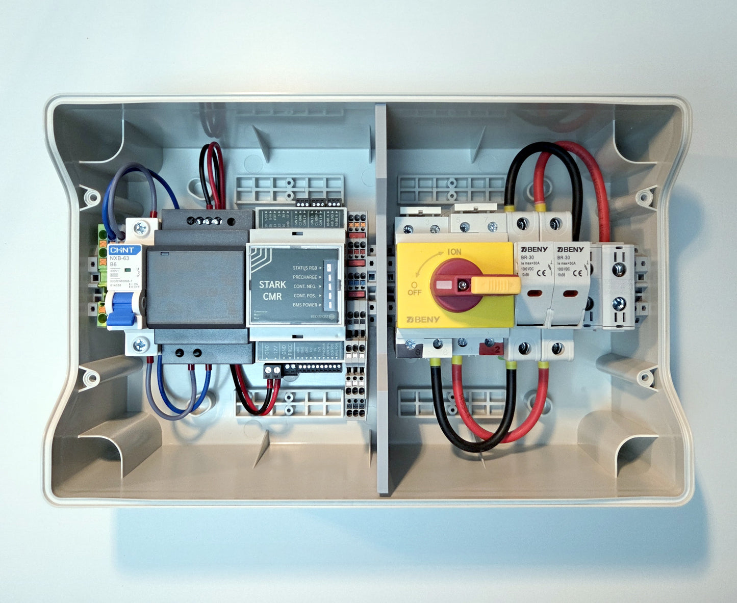 Electrical panel with wiring and components on a light blue background