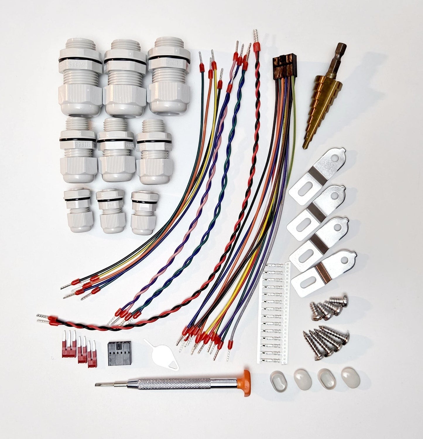 Redispose Stark Box Basic starter kit with cable glands, wires, screws, and a step drill bit.